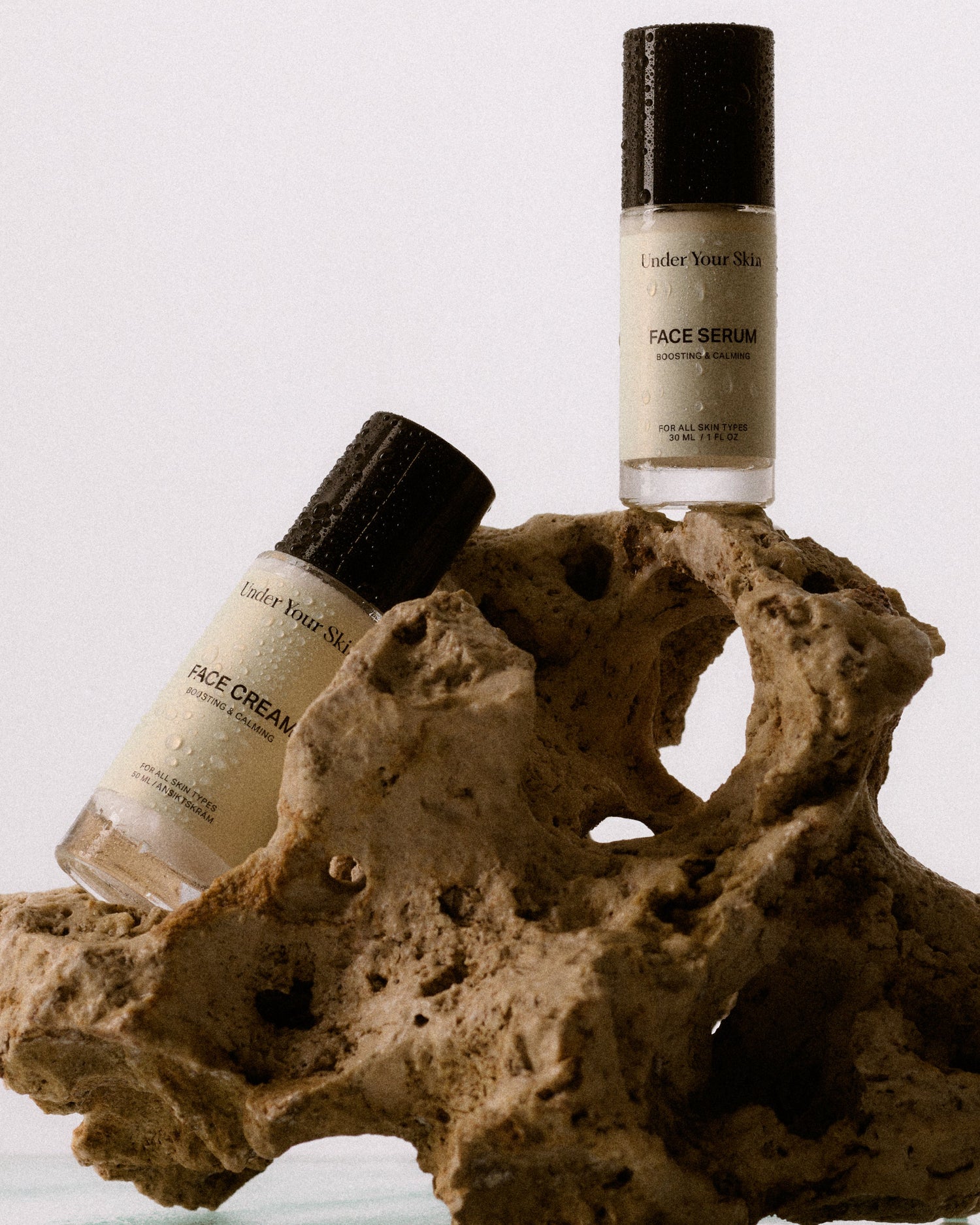 woman holding hydration duo infront of her face