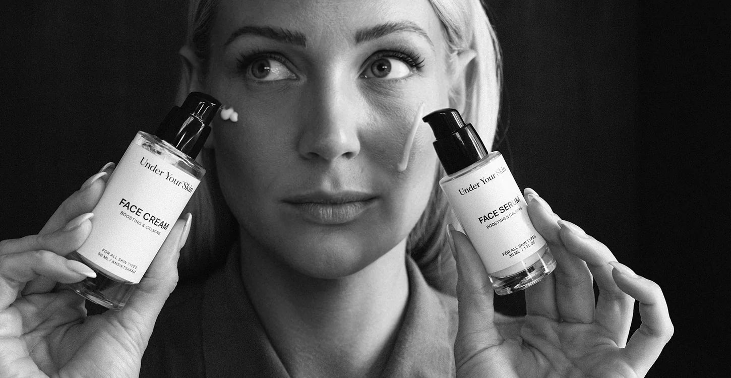 woman holding hydration duo infront of her face