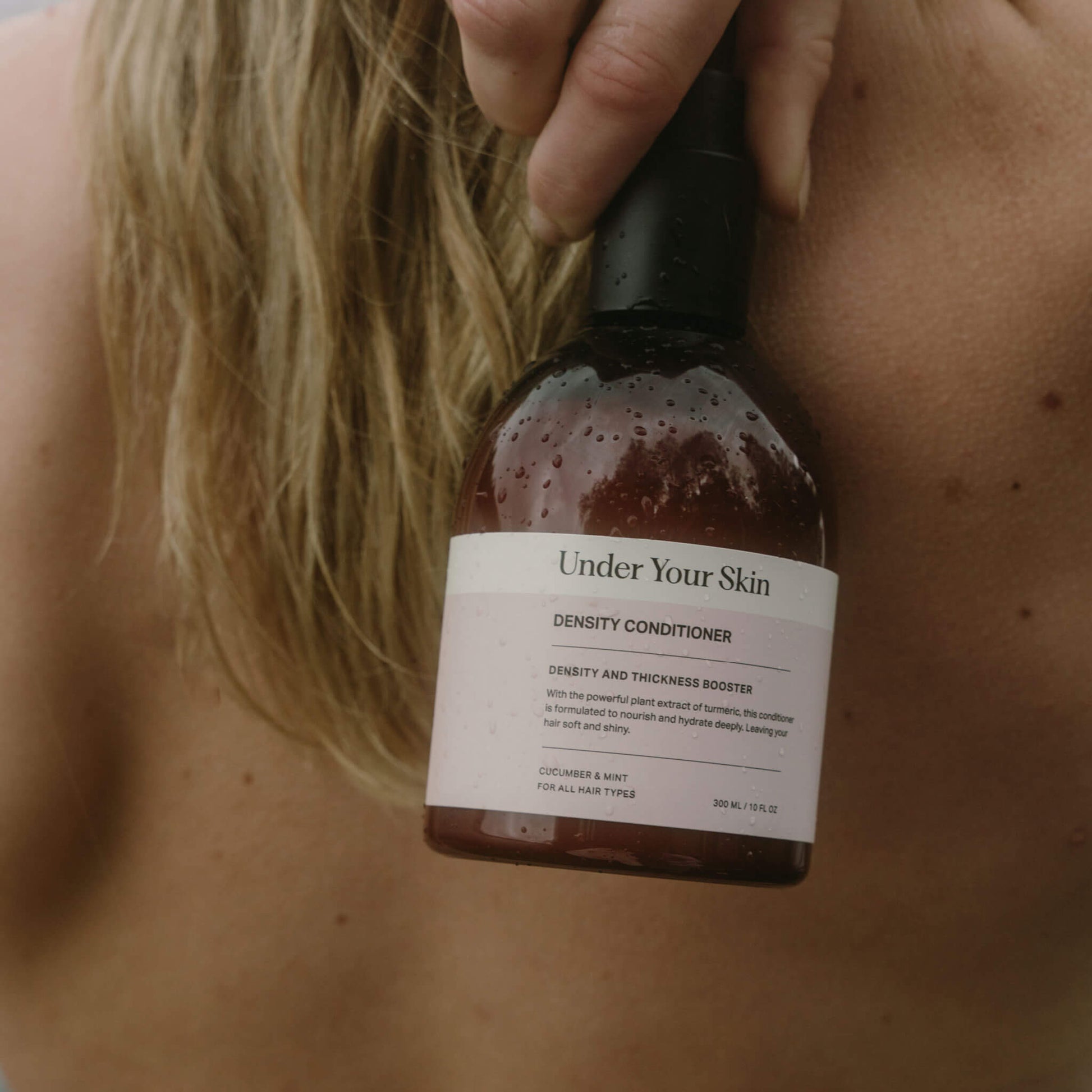 Bottle of Density Conditioner for hydration and thick hair