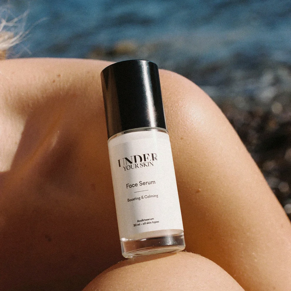 Face Serum placerat på en kvinnas kropp.