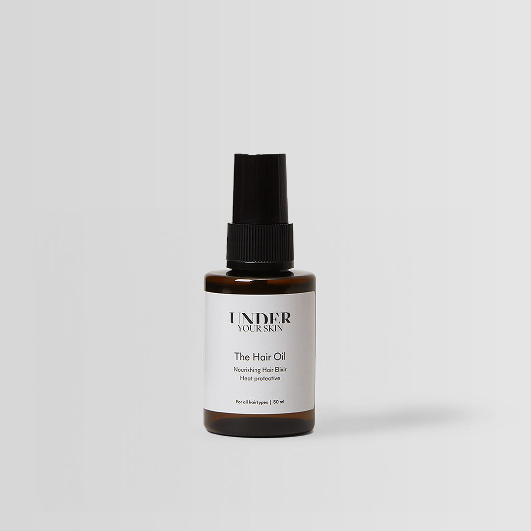 hårolja på en vit bakgrund.