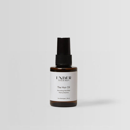 hårolja på en vit bakgrund.