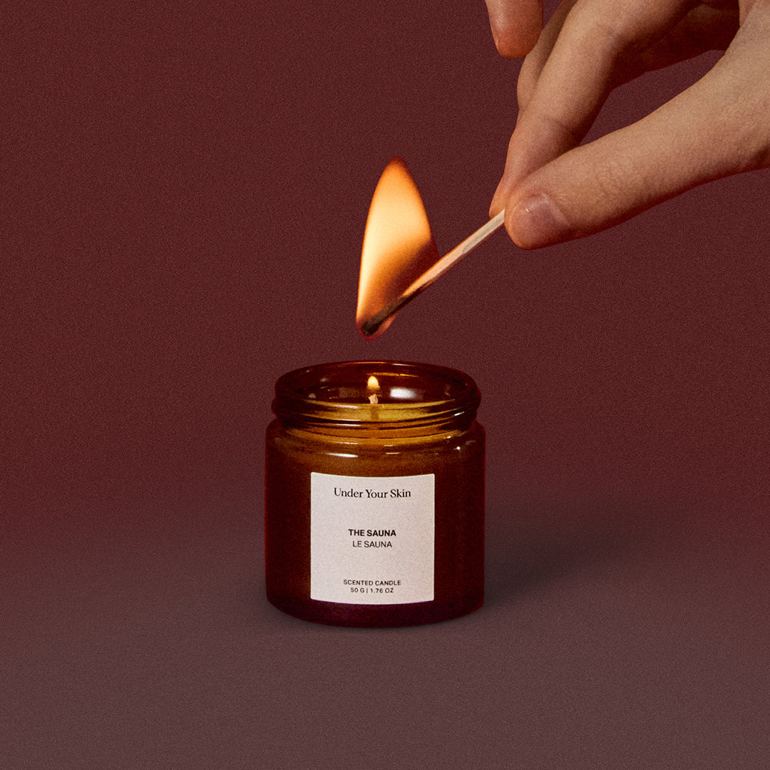 candle is being lit with a match