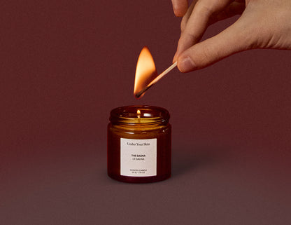 candle is being lit with a match