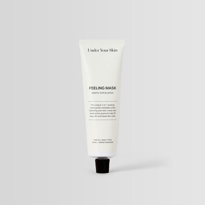 Under Your Skin 2 in 1 Peeling Mask in a 50ml white aluminum tube. Gently exfoliates and hydrates using sea sand.