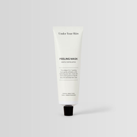 Under Your Skin 2 in 1 Peeling Mask in a 50ml white aluminum tube. Gently exfoliates and hydrates using sea sand.