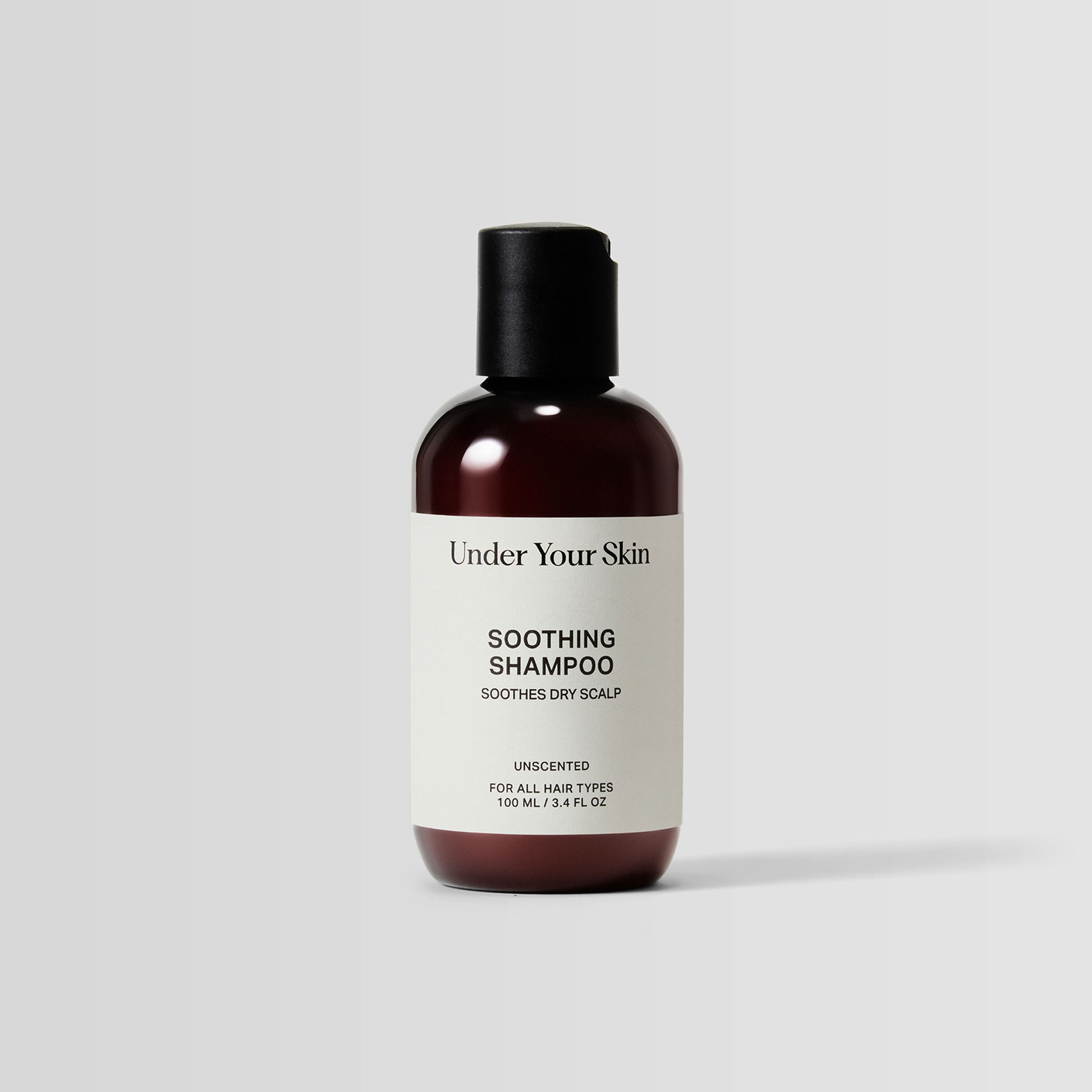 Travel-size bottle of Soothing Shampoo for calming scalp care on the go