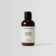 Travel-size bottle of Soothing Shampoo for calming scalp care on the go