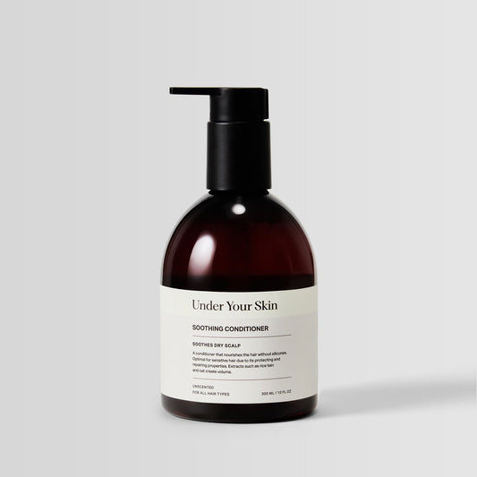 Under Your Skin Soothing Scalp Treatment Conditioner in a 300ml brown bottle with pump. Moisturizes and nourishes sensitive scalps.