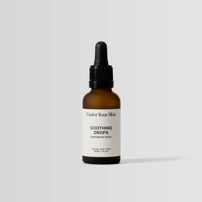 Under Your Skin Soothing Scalp Drops in 30ml brown bottle with pipette applicator. For scalp relief and reduced irritation for all skin types.