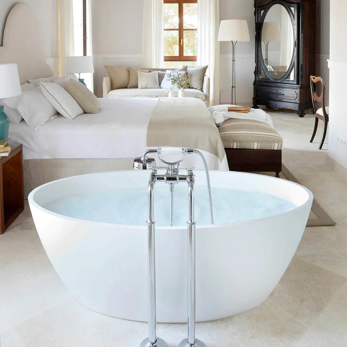 Image of a hotel room with a bathtub. 